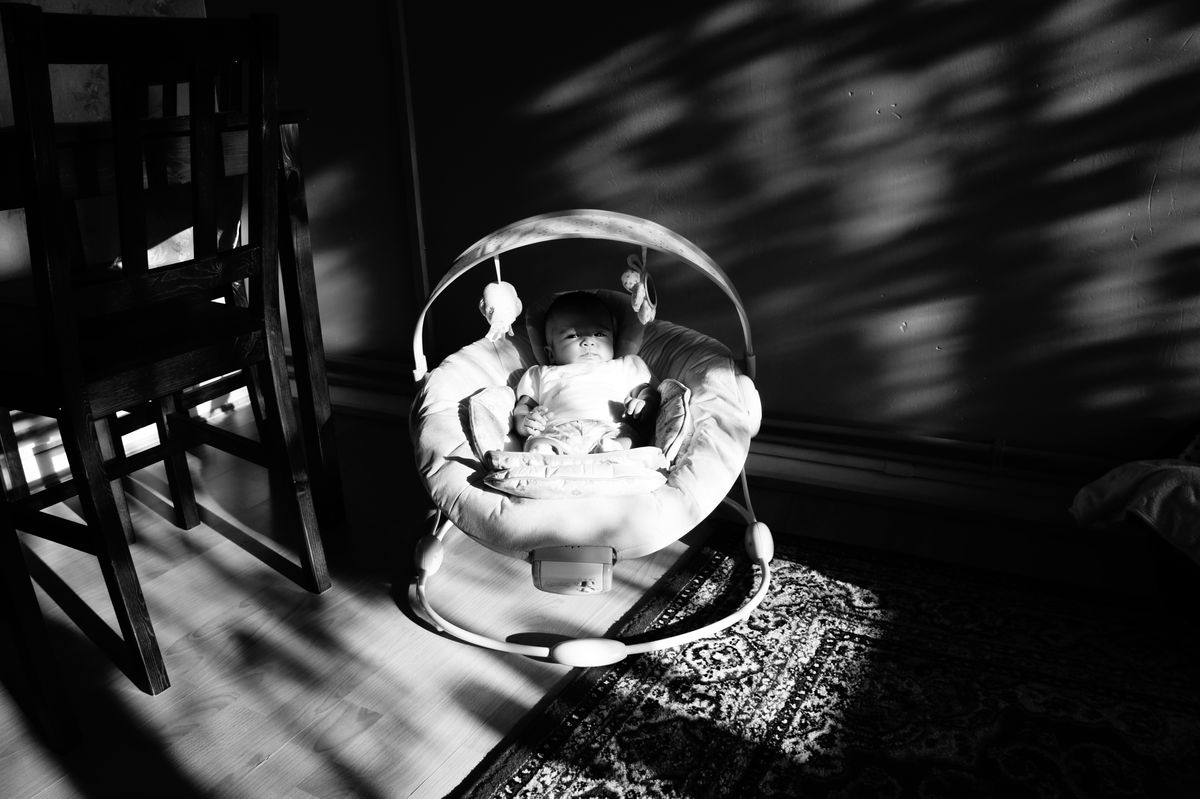 baby sunbathing in the living room