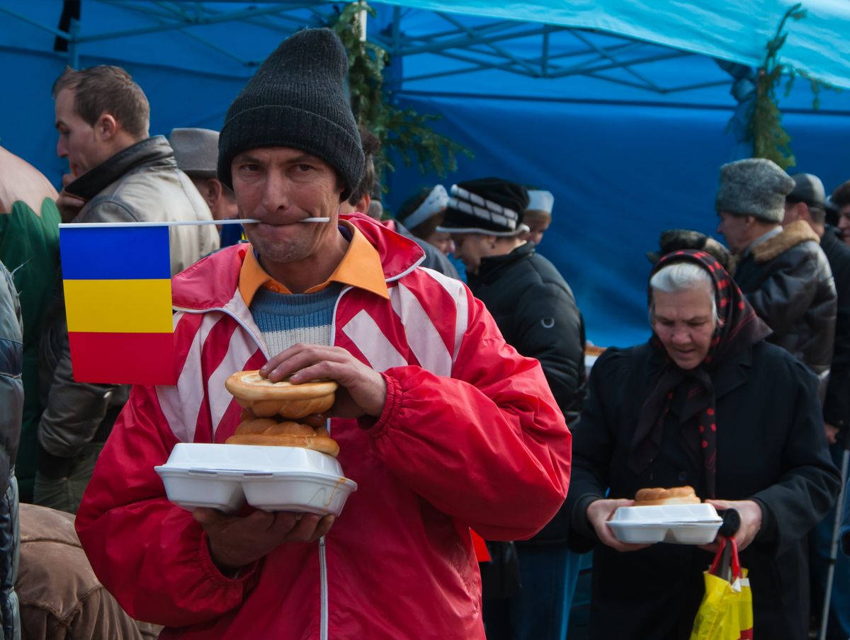 Romania, at the national day anniversary, authorities give a hot meal to poor people