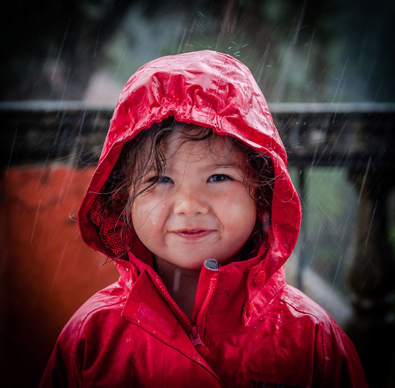 My gran daughter standing  in the rain at Portmeirion