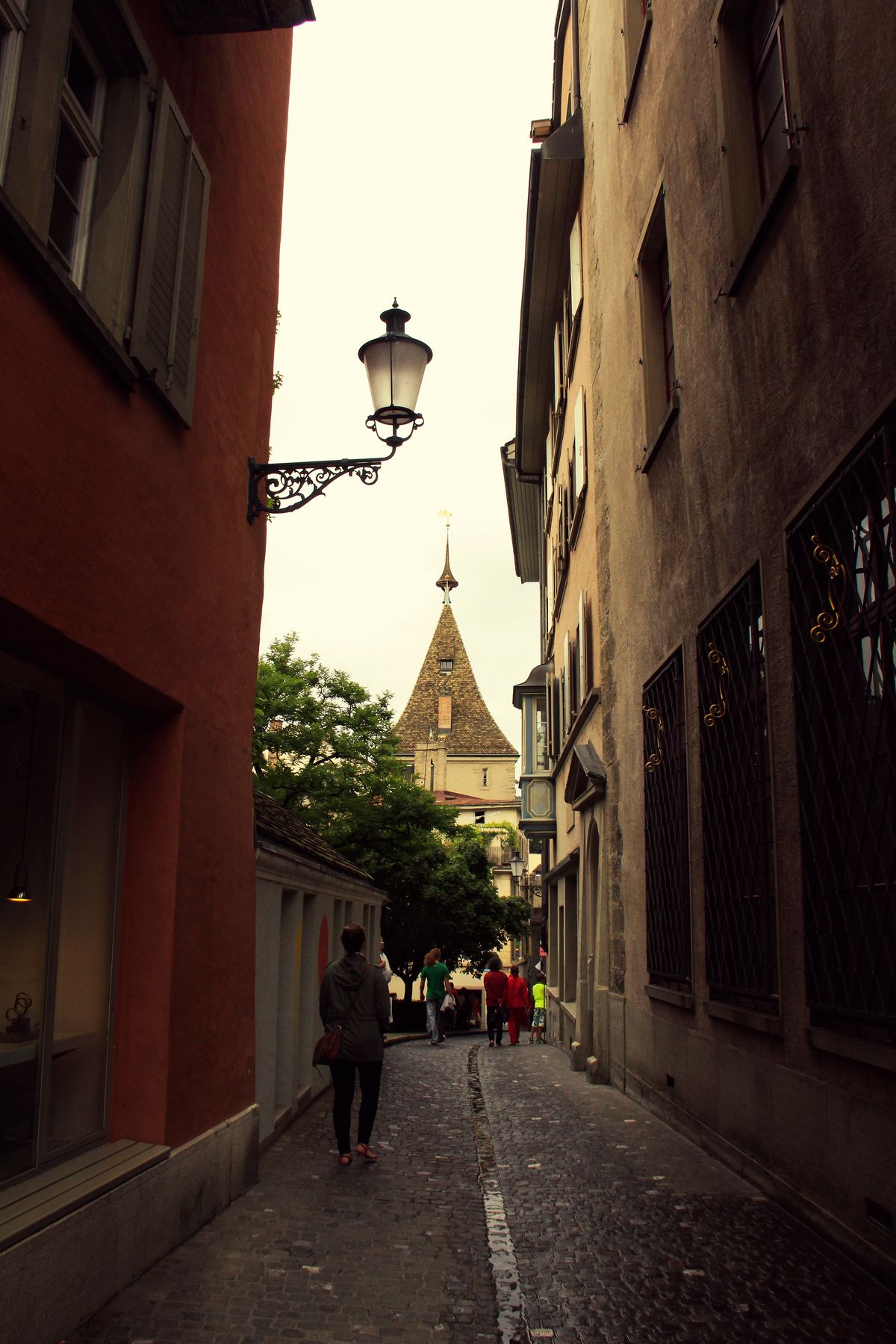 Another narrow alley of Zurich, capturing amazing local architecture in the background