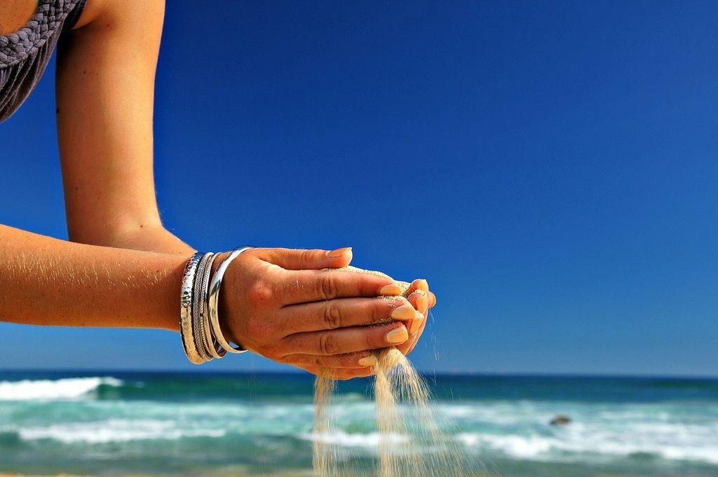 beach sand in the hands, taken at west coast, south africa